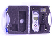 A silver-gray AFI series advanced digital force gauge inside a protective carrying case, shown with a power adapter, batteries, and a hook attachment