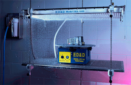 ED&D Model DBX-1000 Drip Box System with an ET1-02 turntable performing IPX1 water ingress testing on a specimen.