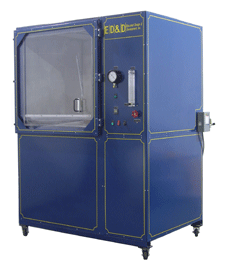 Large blue DTC-300 Dust Test Chamber with a clear viewing window, integrated vacuum gauge, and right-mounted control panel.