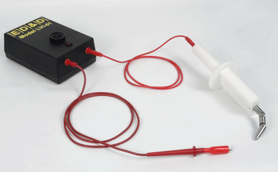 Model LVI-01 Electrical Contact Indicator box with red connecting leads and tapping clips connected to a TFP-01 jointed finger probe.
