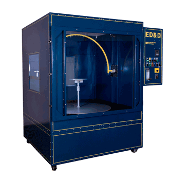 Large blue STC-DBX combo test chamber featuring an integrated oscillating spray tube and specimen turntable for IPX1 through IPX4 testing.